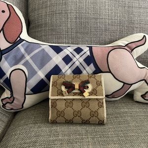 Gucci monogram wallet with ribbon